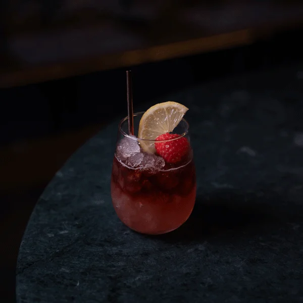 A tumbler with a Port & Bramble cocktail